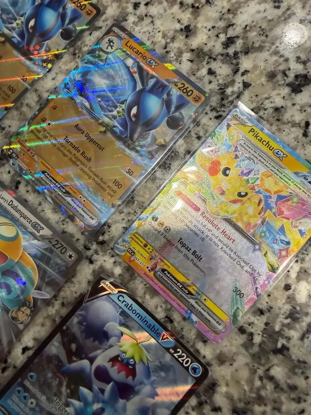 Lot of 9 Assorted Pokémon Trading Cards featuring EX, V, and Tera variants